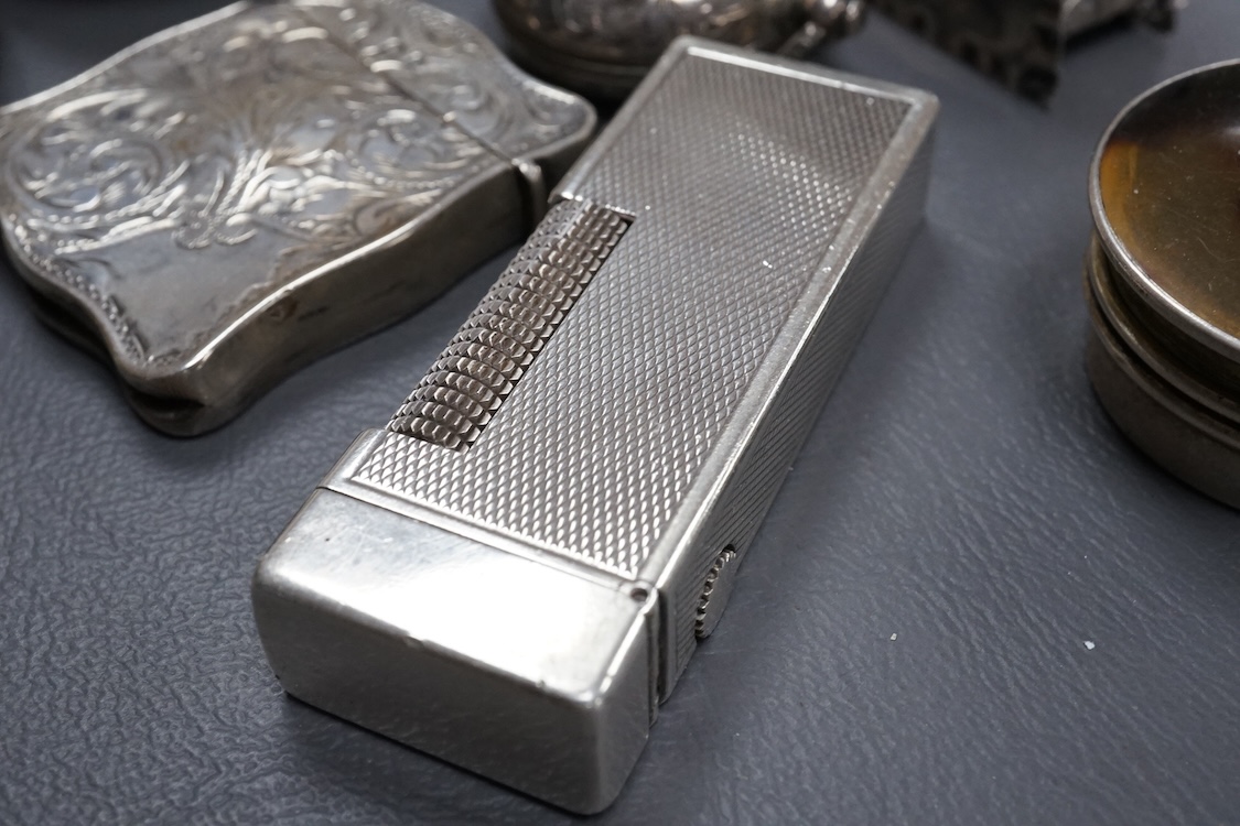 A Dunhill silver plated lighter and seven other items of collectable silver, including a modern silver caddy spoon by Pepper & Hope Ltd, a Victorian silver sovereign case, an Edwardian silver sovereign case, vesta case,